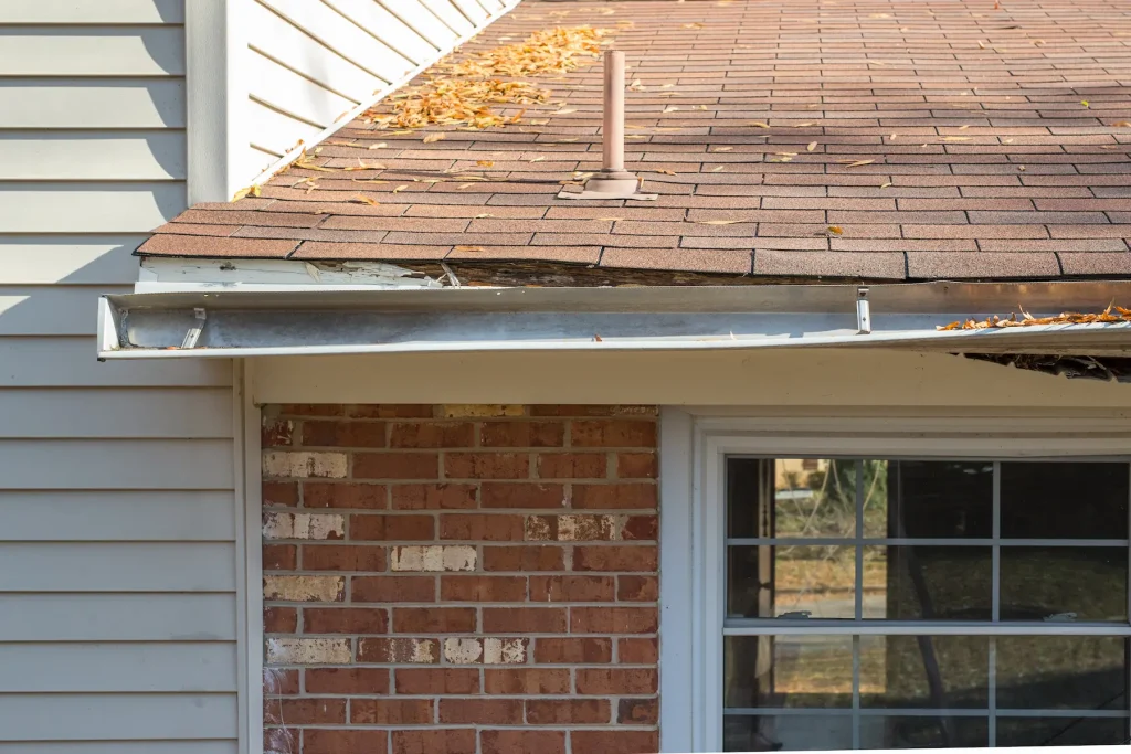 old broken rain gutters on a house